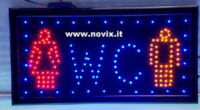 Illuminated sign written with WC LED.